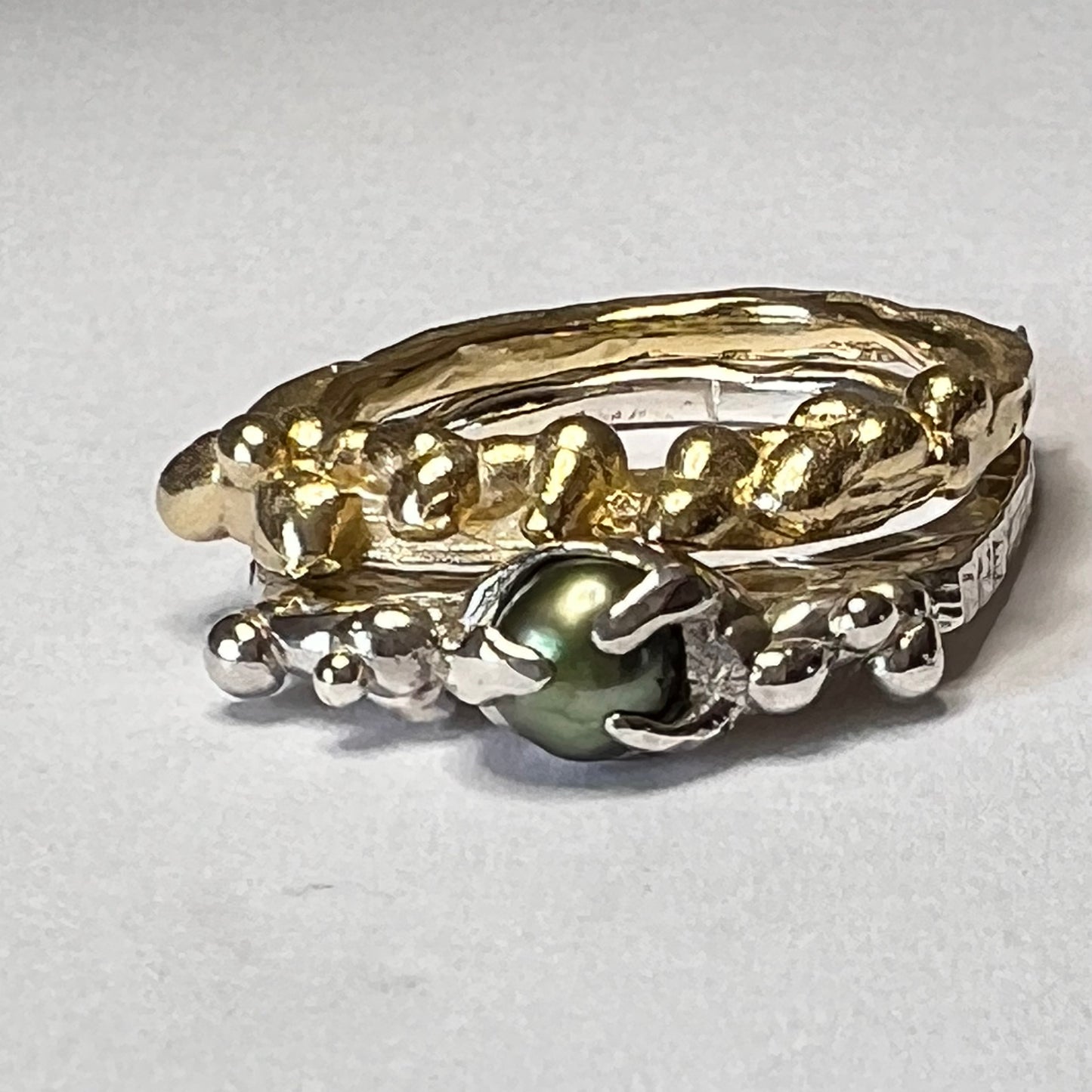 Silver Band with green pearl and gold stacker ring